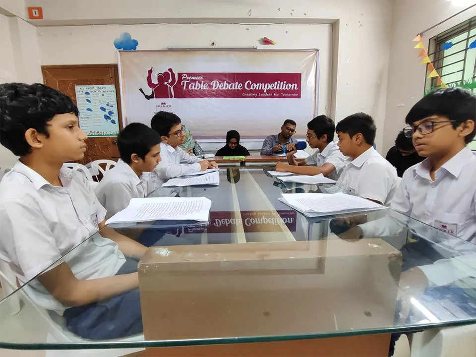 Students participating in Premier School Dhaka’s 2023 table debate competition